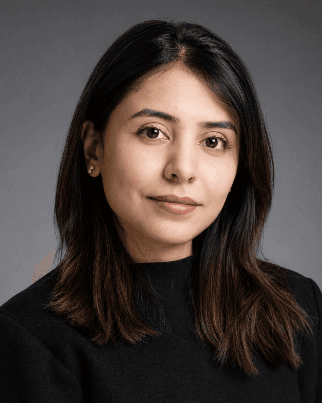 Professional headshot of a woman with long dark hair and brown eyes wearing black.